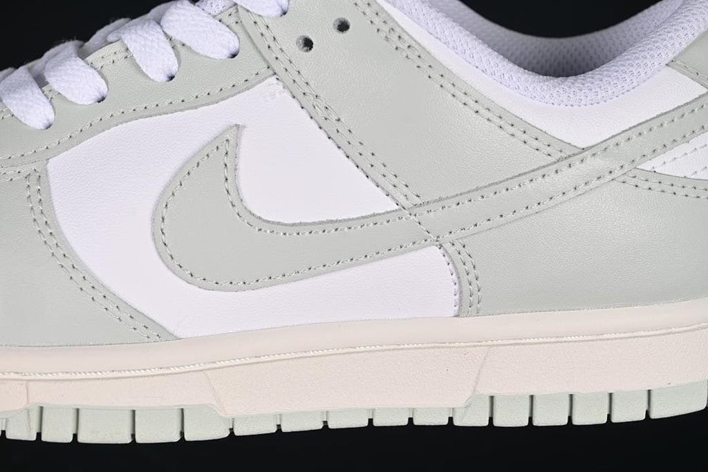 Close-up of the grey side swoosh and layered panels