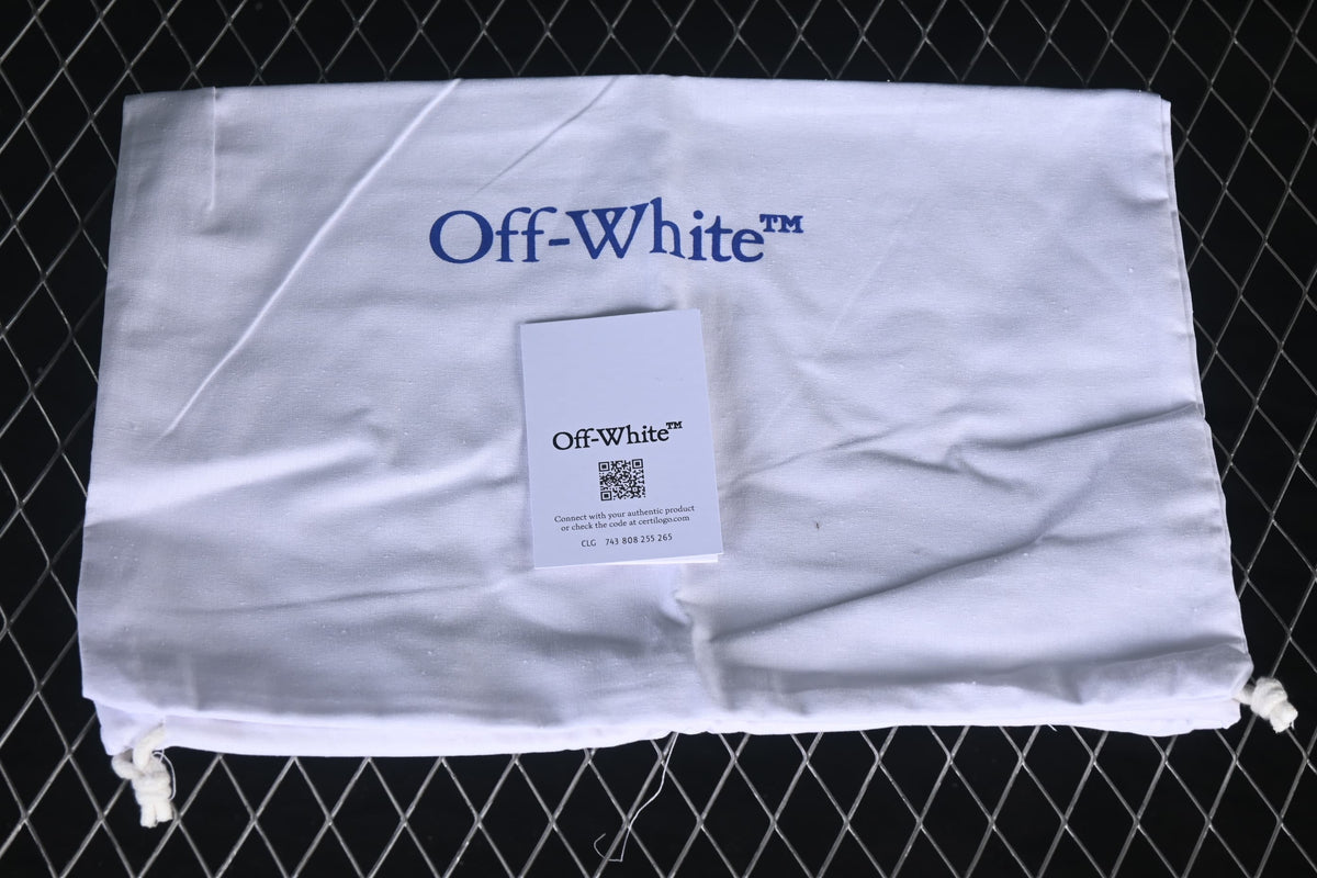 White branded drawstring bag and card shown with the sneakers