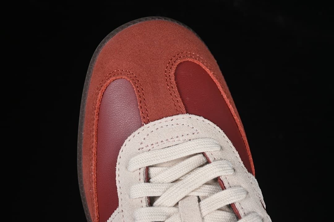 Top view of the rust-toned toe overlays and laces