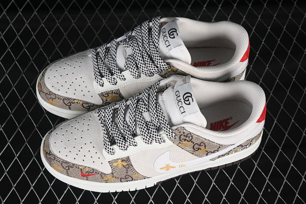 Pair of low-top sneakers shown from above, featuring perforated white toe boxes, patterned brown panels, and black-and-white laces.