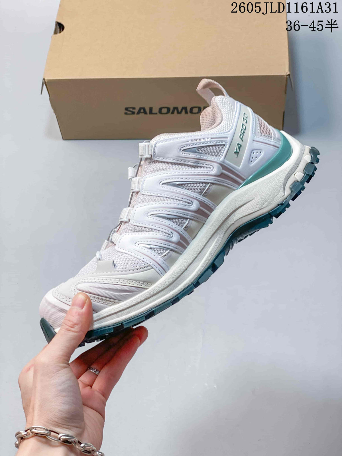 Side view of a white Salomon XA Pro 3D sneaker with lilac overlays and teal accents