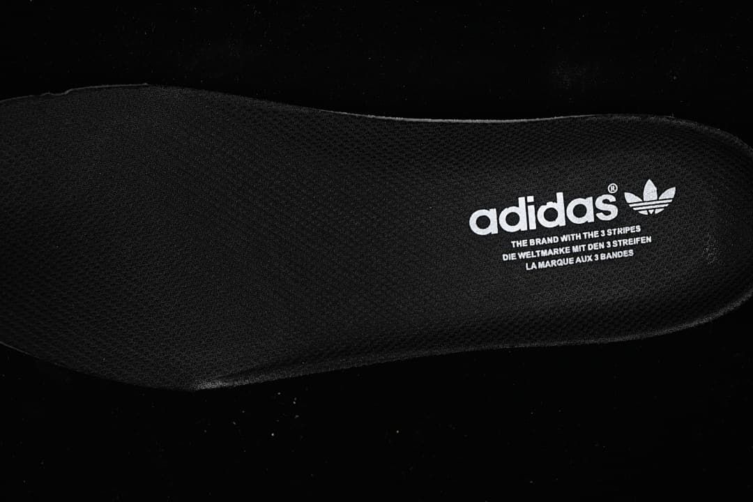 Close-up of the black insole with adidas branding.