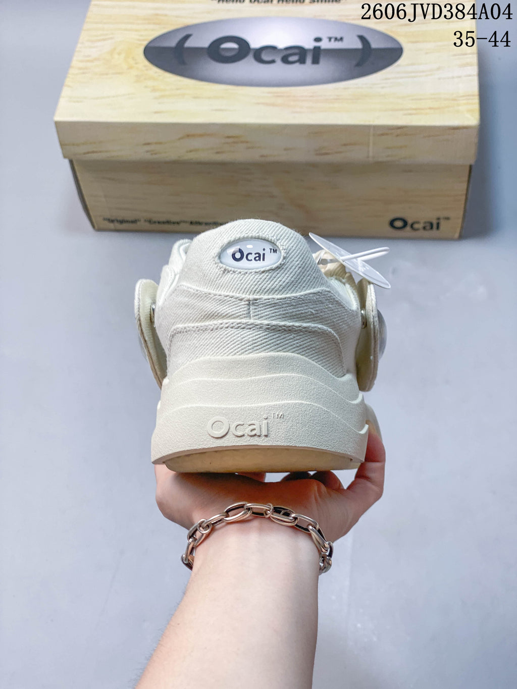 Rear view of a cream Ocai sneaker showing padded heel and sculpted sole