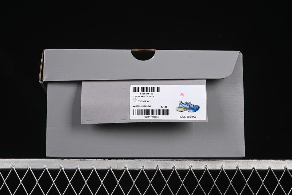 Shoe box label showing style W3XTS 9479, color White/Blue/Yellow, and size 38