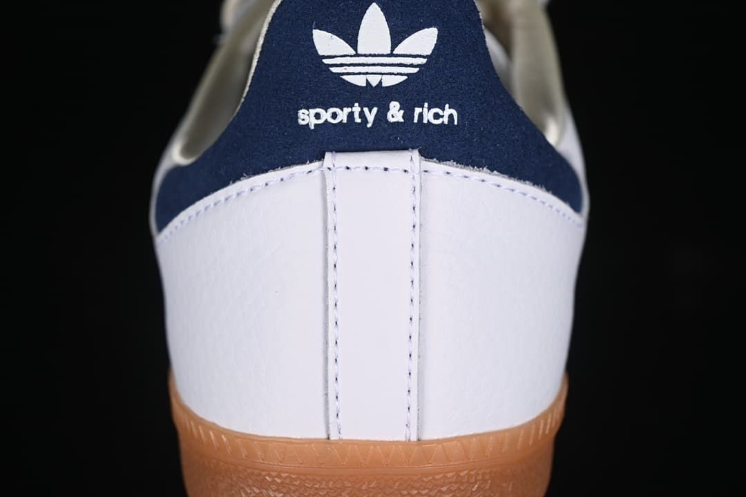 Rear view showing the navy heel tab with adidas Trefoil and Sporty & Rich branding