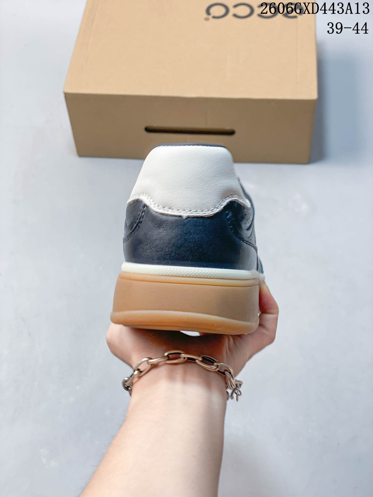 Rear view showing the white heel panel and gum-colored sole