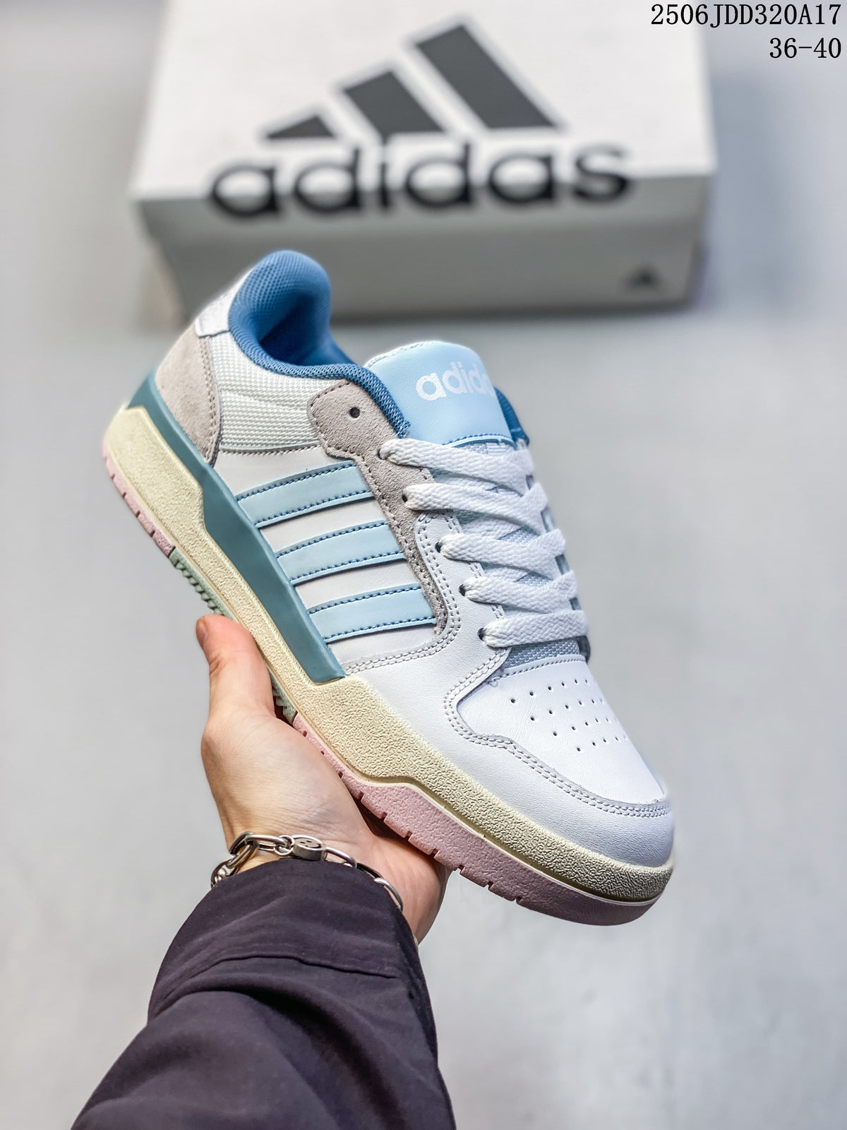 Angled view of a white and light blue adidas Entrap sneaker with gray and cream details.