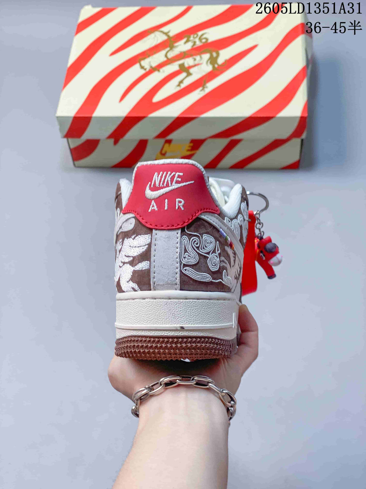 Rear view of the sneaker showing embroidered heel panels and a red heel tab.