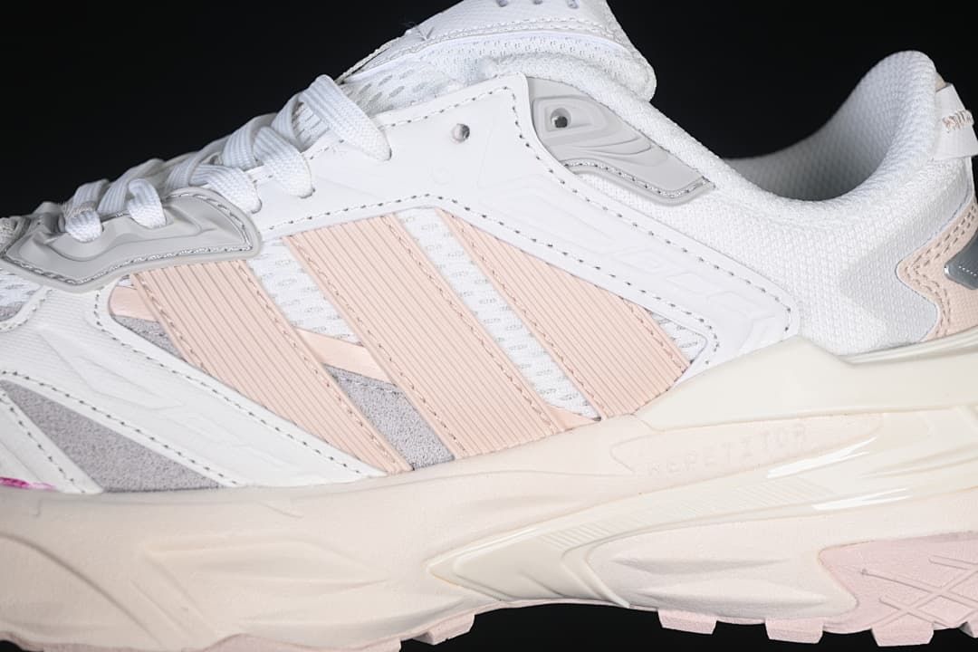 Close-up of the layered side panels and pink stripe details