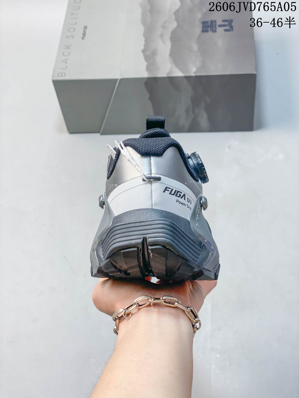 Rear view showing the shoe heel, external support structure, and outsole.