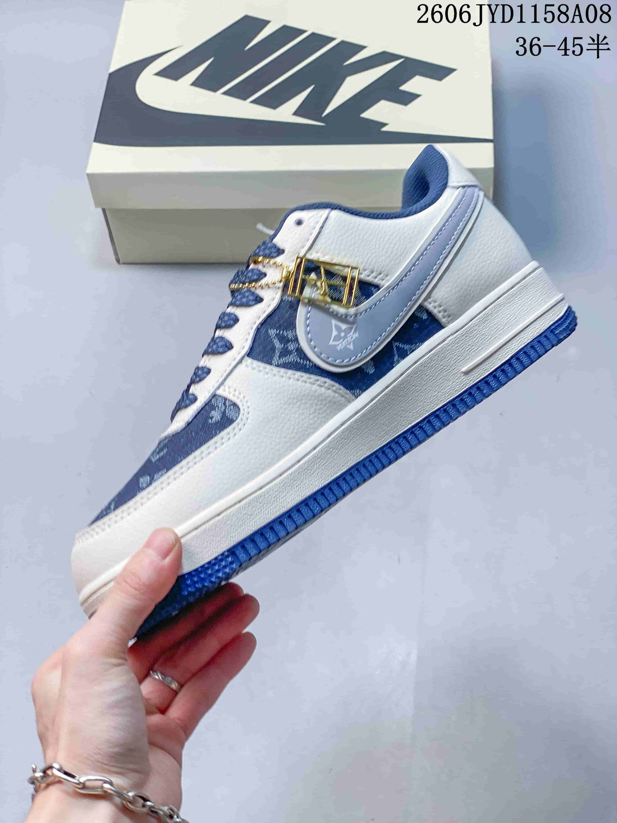 Side profile of a blue and white patterned low-top sneaker with a pale blue side detail