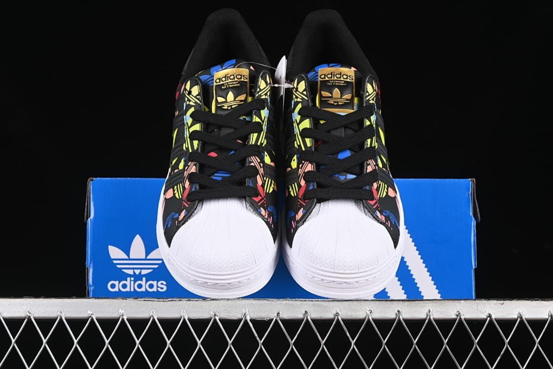 Front view of the pair showing shell toes and printed uppers