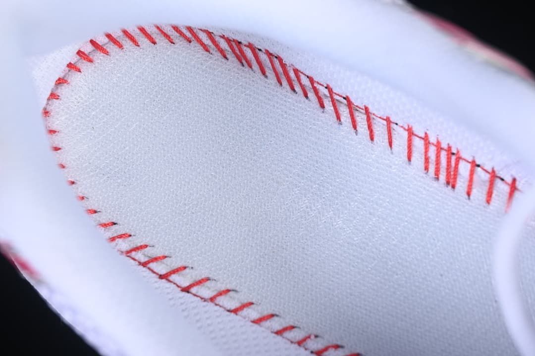 Close-up of stitching on the sneaker's white lining.