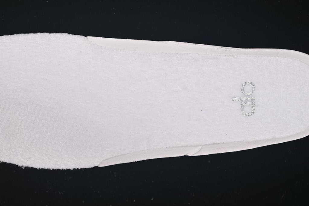 Close-up of the light-colored insole with Alo branding