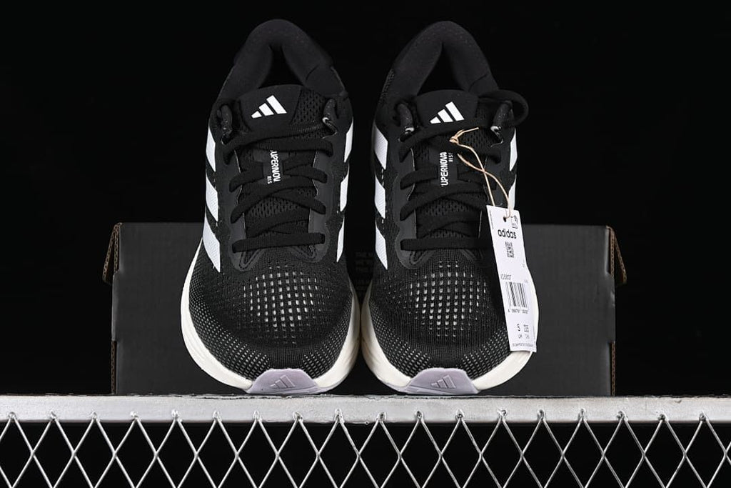 Front view of the pair showing the toe boxes, laces and tongue logos.