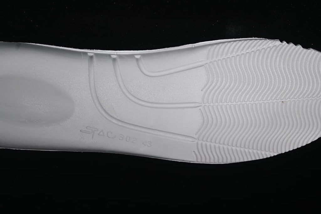 Close-up of the sneaker outsole tread and molded markings