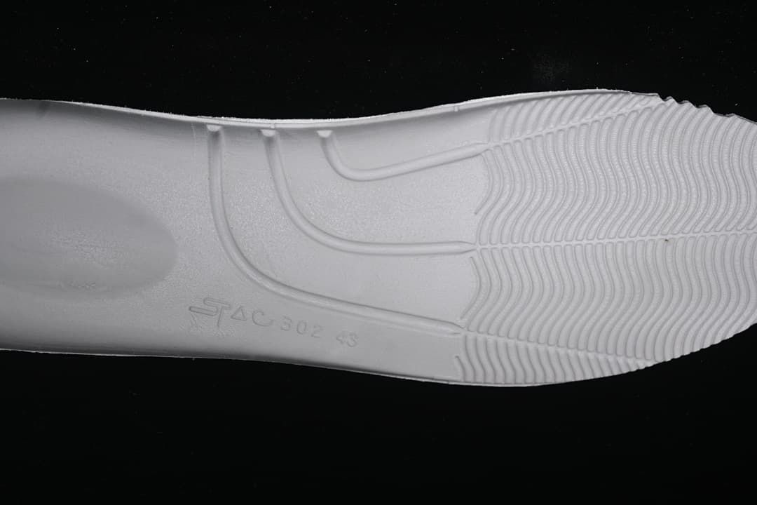 Close-up of the sneaker outsole tread and molded markings