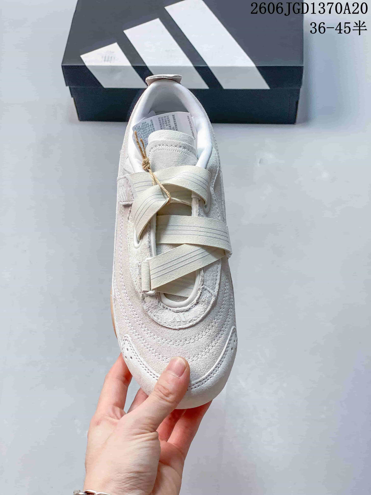 Top view of the shoe showing its crossing straps and rounded toe