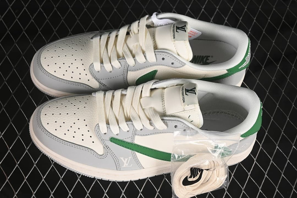 Overhead view of a pair of grey, white, and green low-top sneakers with an extra lace set