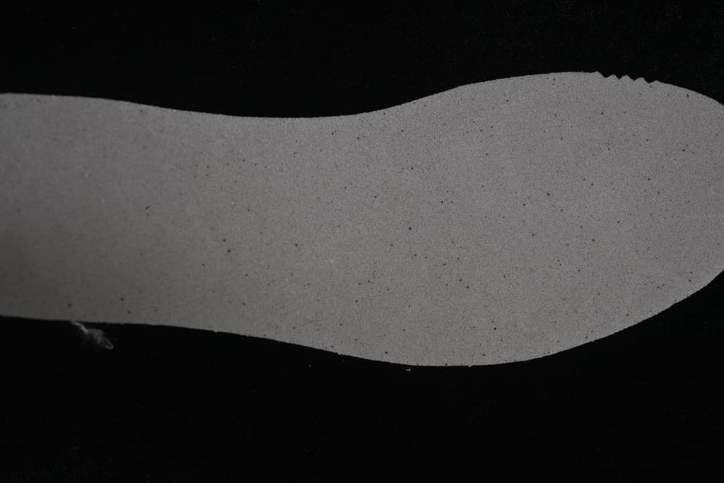 Close-up of the dark outsole and its textured tread.