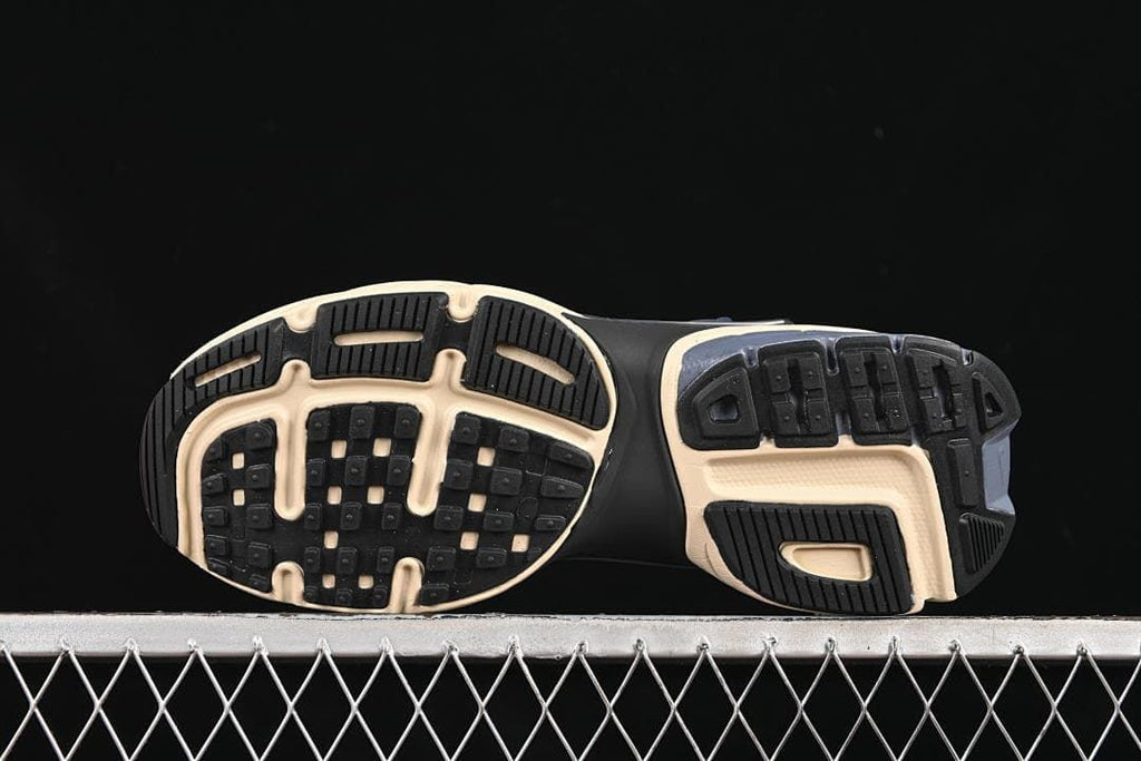 Underside view showing the patterned sneaker outsole