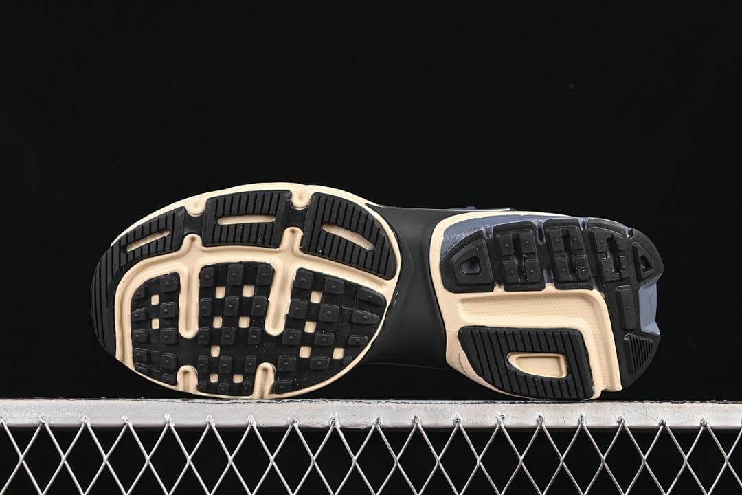 Underside view showing the patterned sneaker outsole