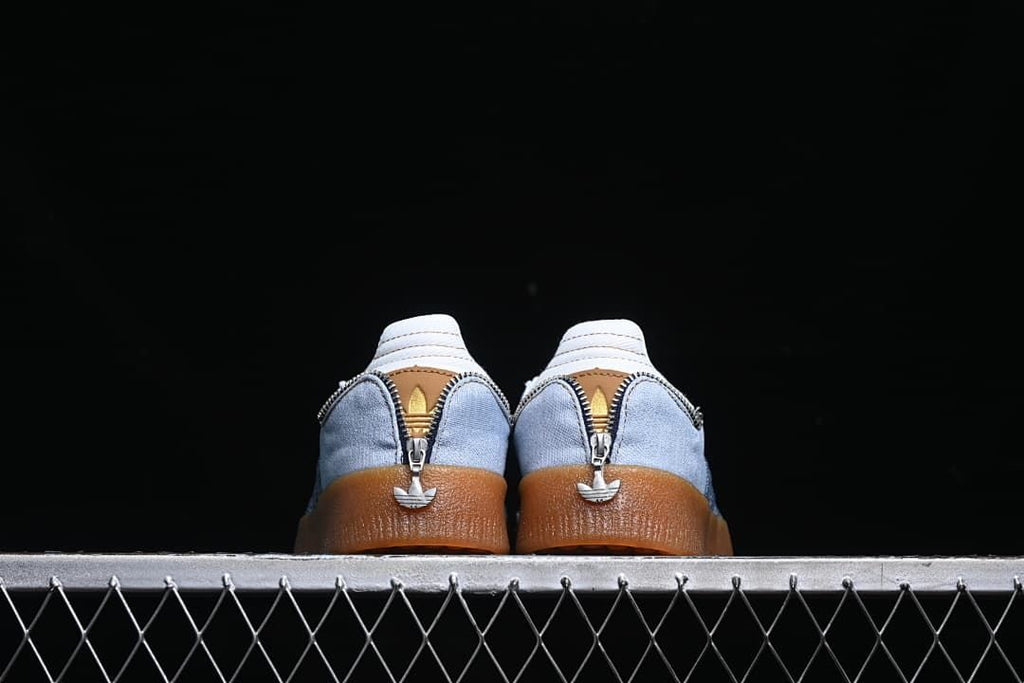 Rear view of both sneakers showing zipper details