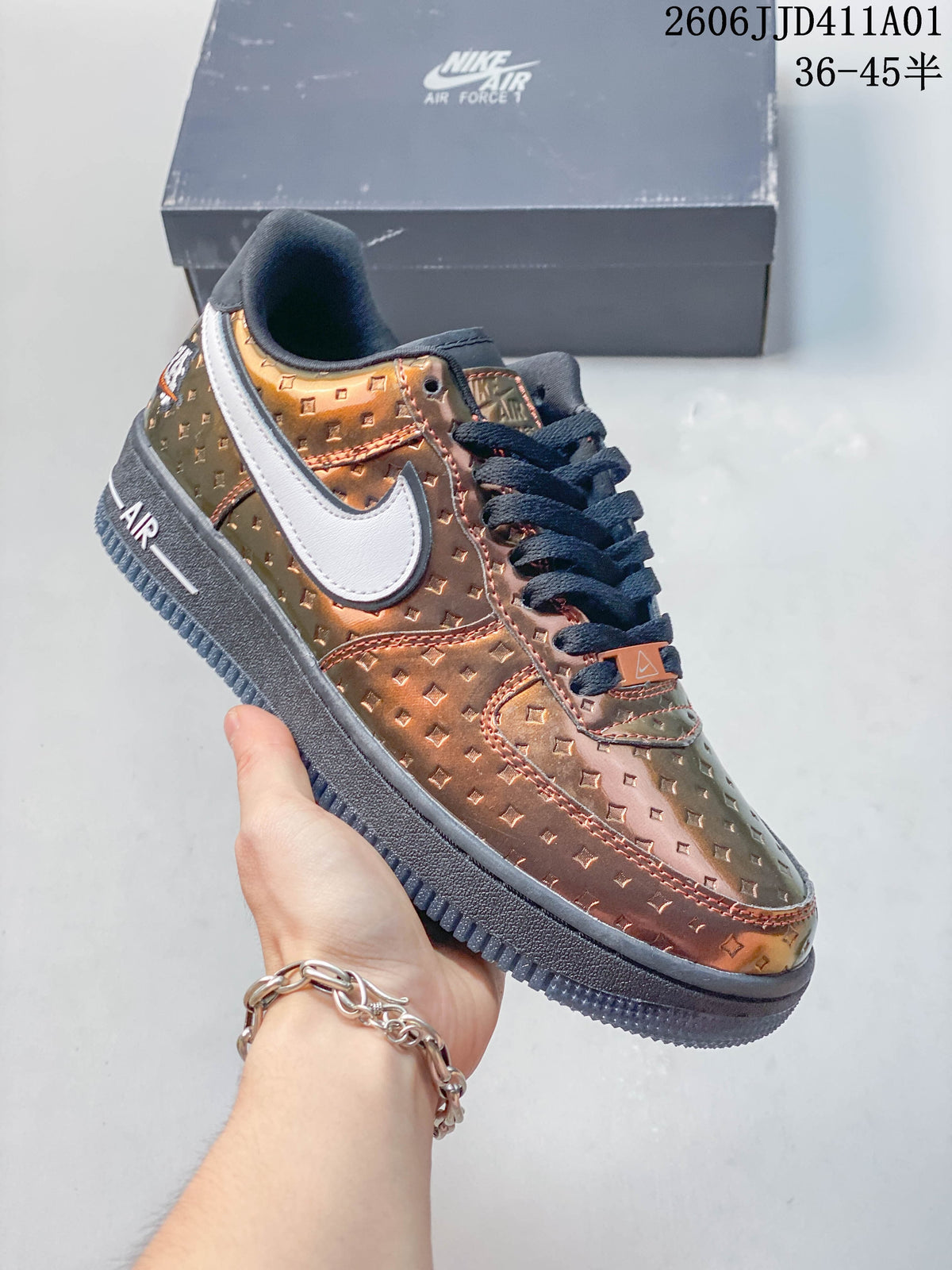 Side view of a copper-toned patterned Nike Air Force 1 low-top sneaker with dark laces and a white side detail.