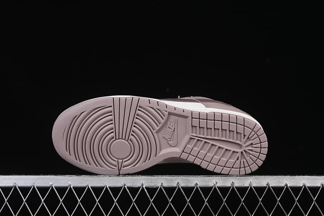Underside view showing the patterned rubber outsoles.