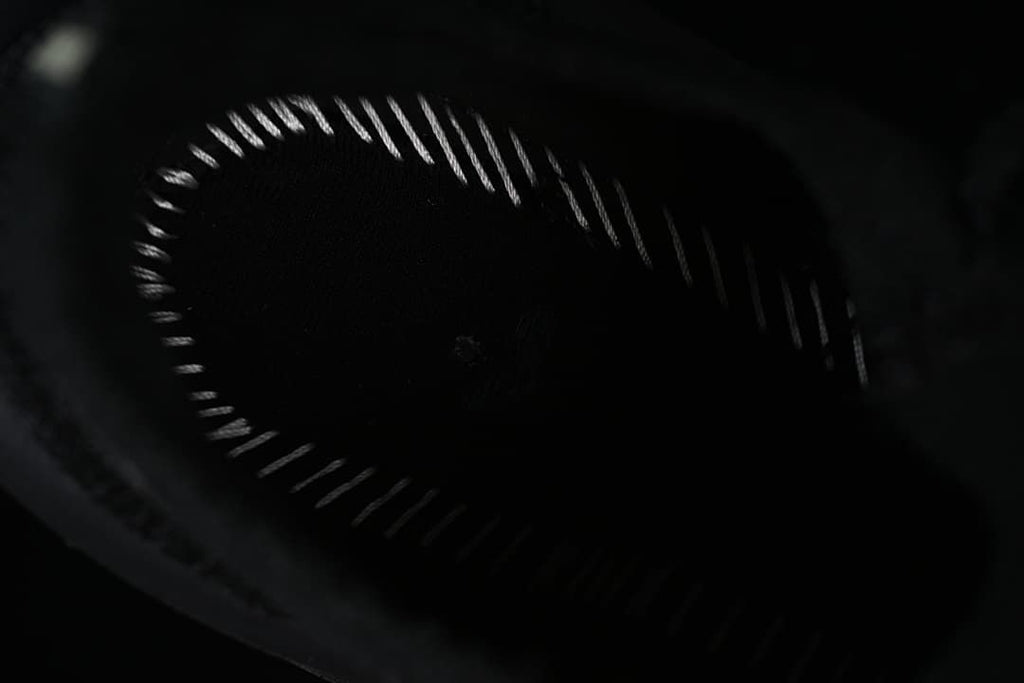 Dark close-up view inside the shoe