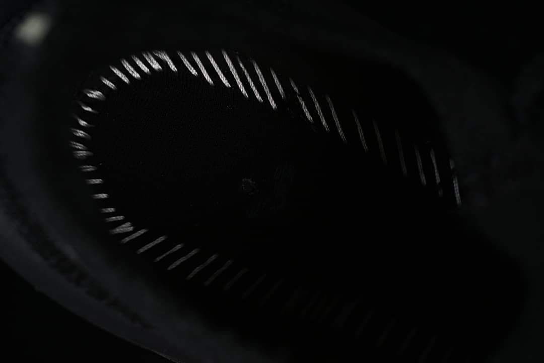 Dark close-up view inside the shoe