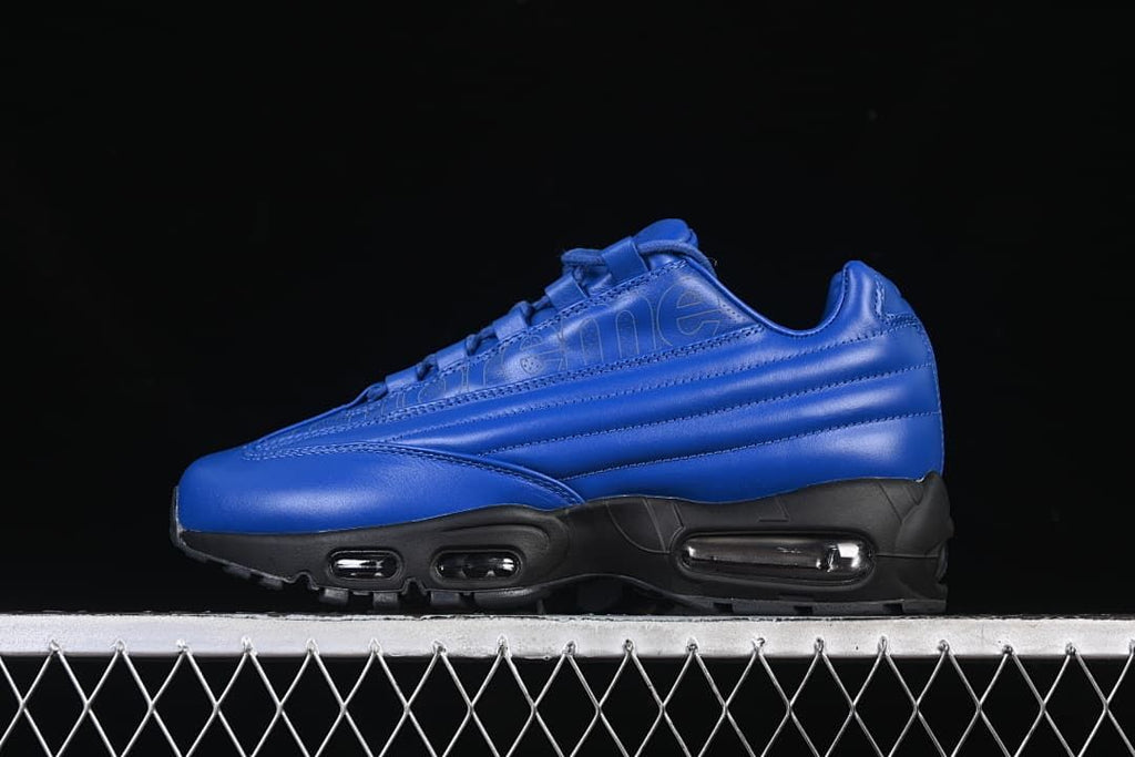 Side view of blue Nike Air Max 95 Lux x Supreme sneakers with a black sole.