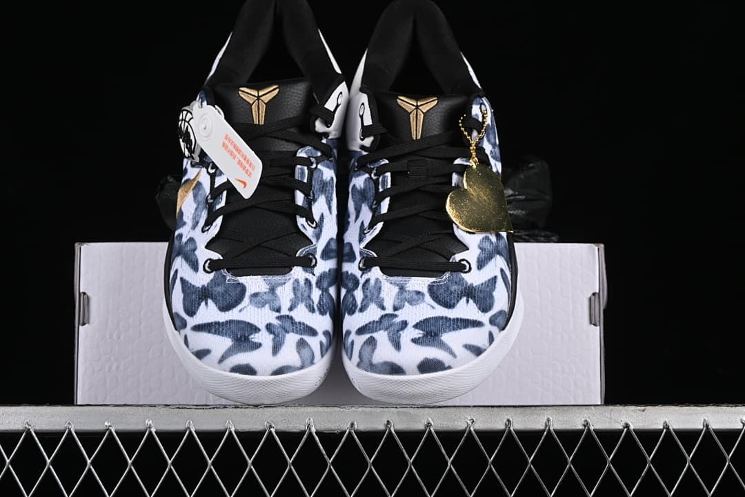 Front view of the pair showing patterned toes, black tongues, and gold Kobe logos.