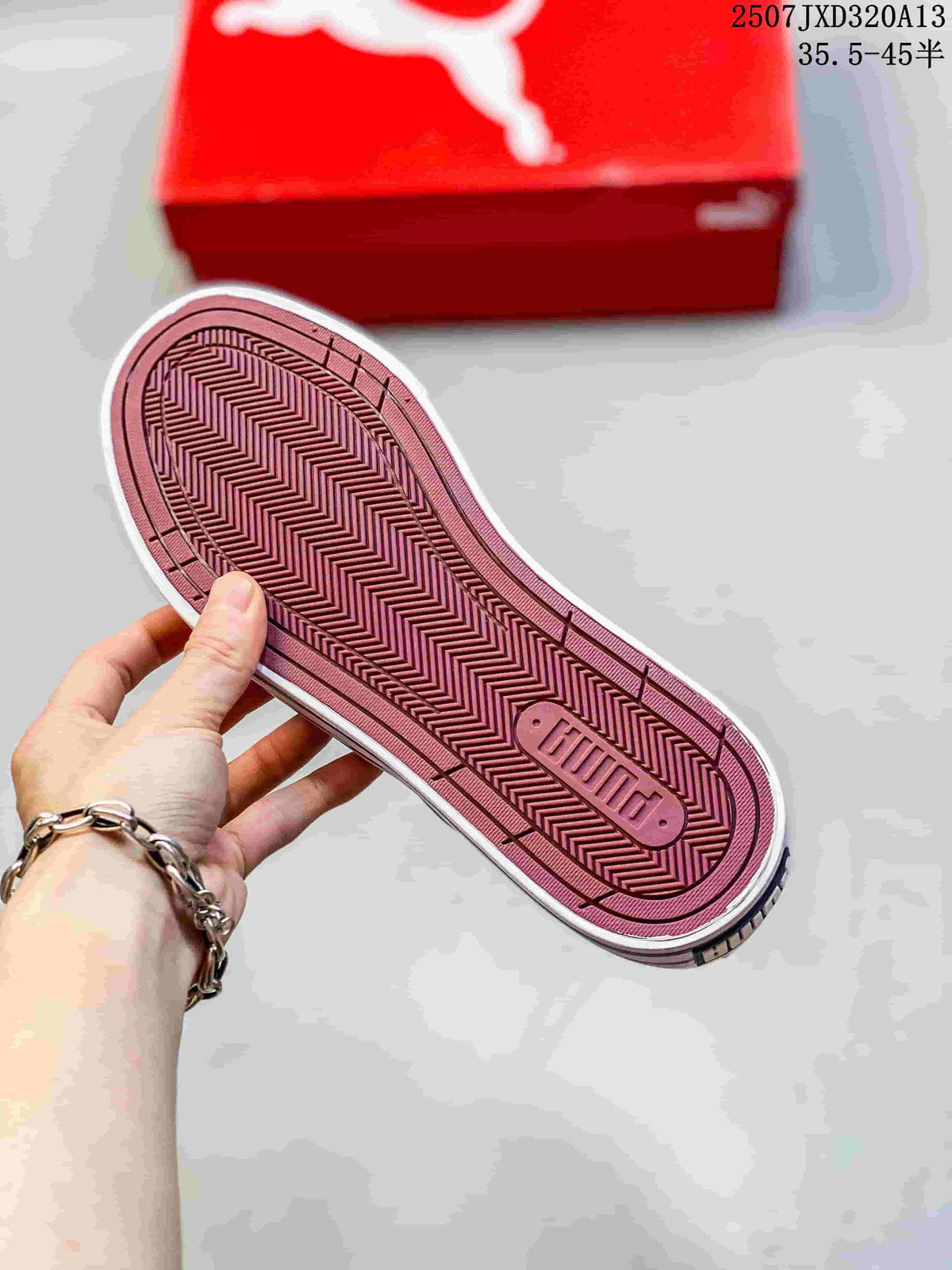 Close-up of the patterned burgundy outsole on a PUMA sneaker.