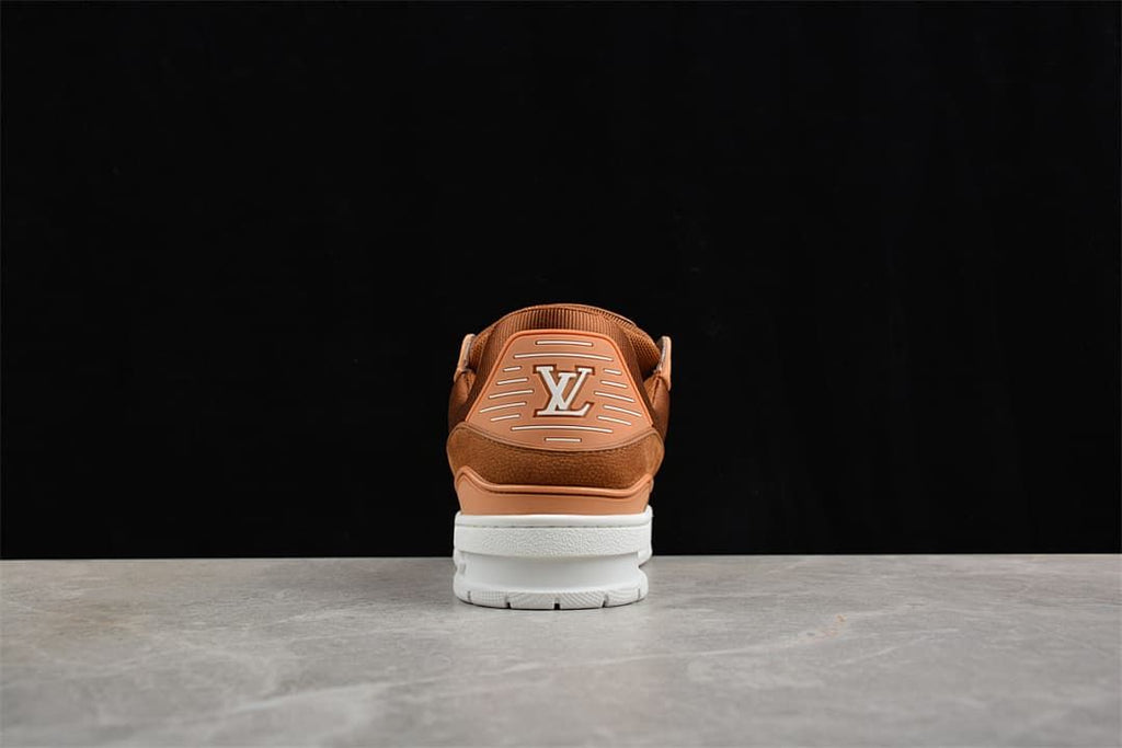 Rear view of a brown LV Trainer sneaker with logo detail and white sole