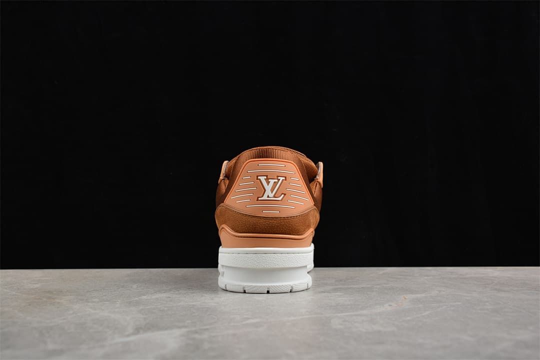 Rear view of a brown LV Trainer sneaker with logo detail and white sole