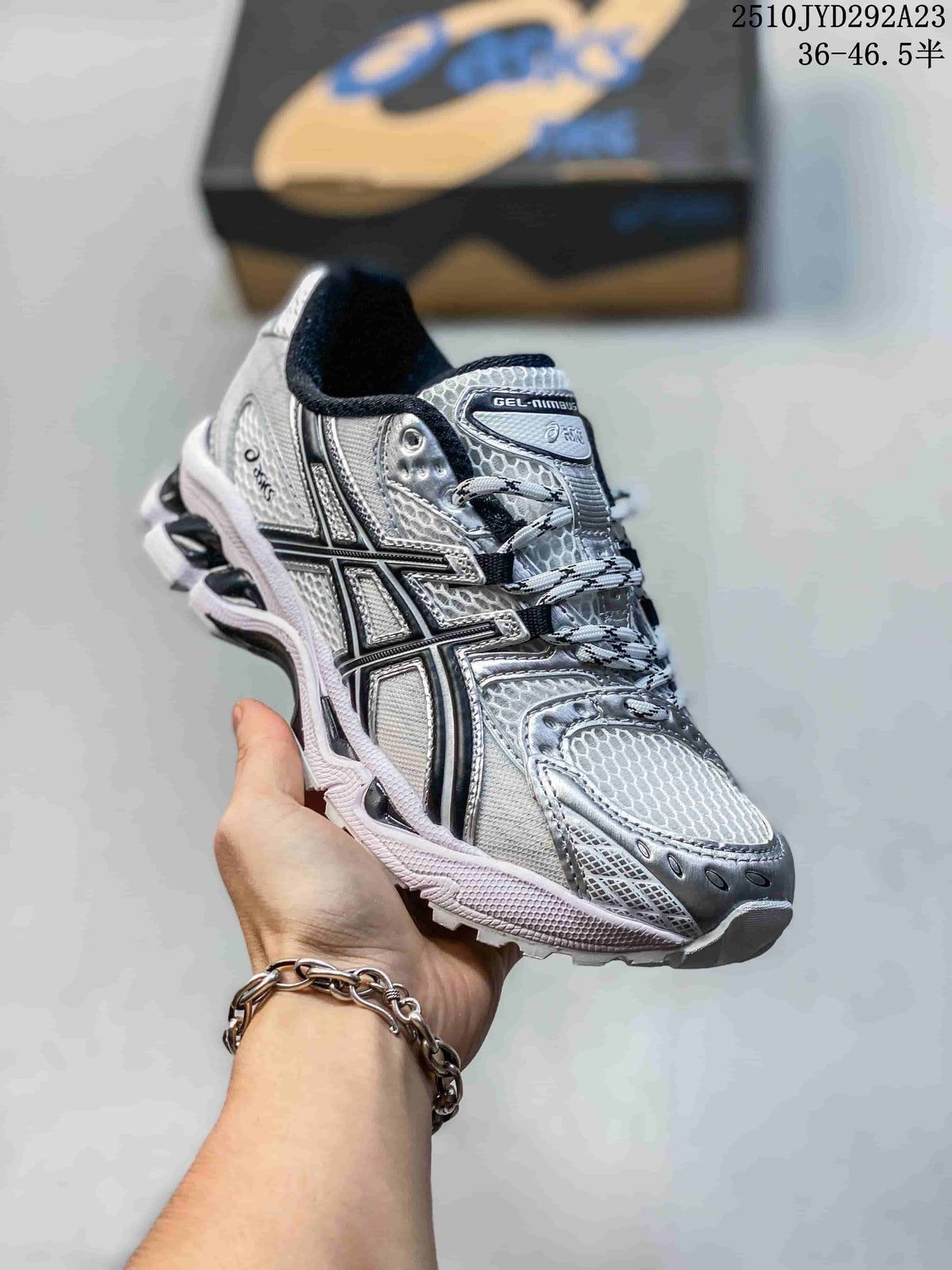 Angled view of the silver ASICS sneaker showing its side stripes and layered upper