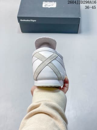 Rear view showing the heel overlay, silver crossed stripes and low-profile sole.