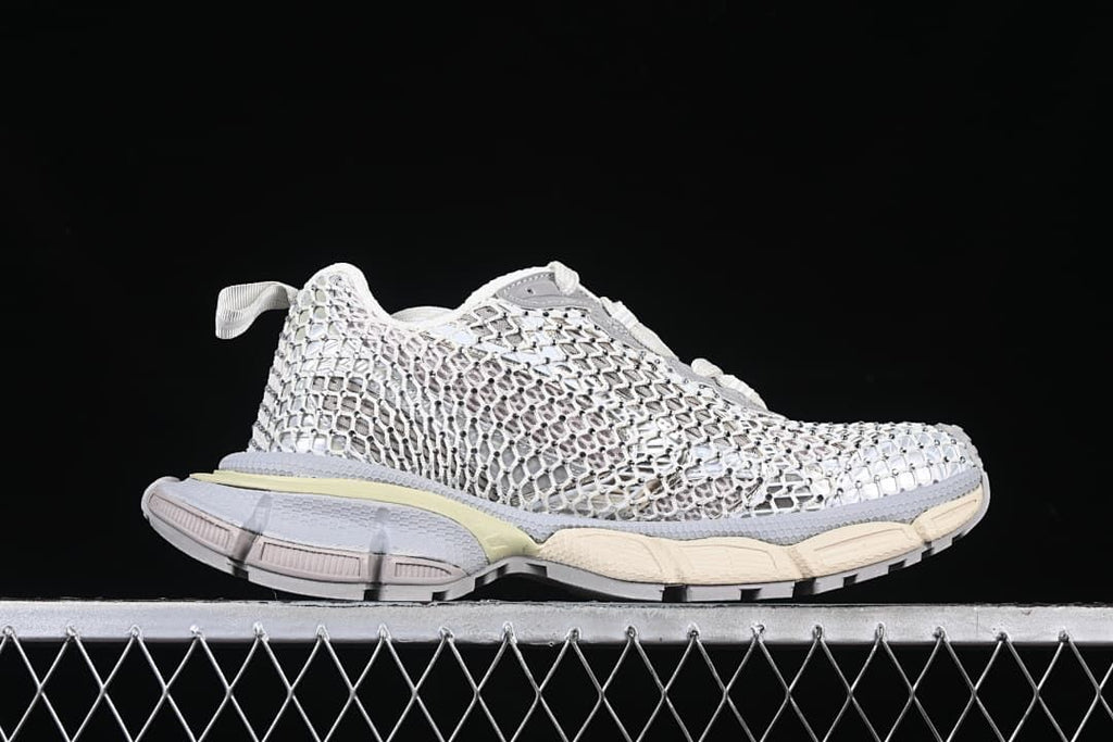 Side profile highlighting the layered upper and segmented sole