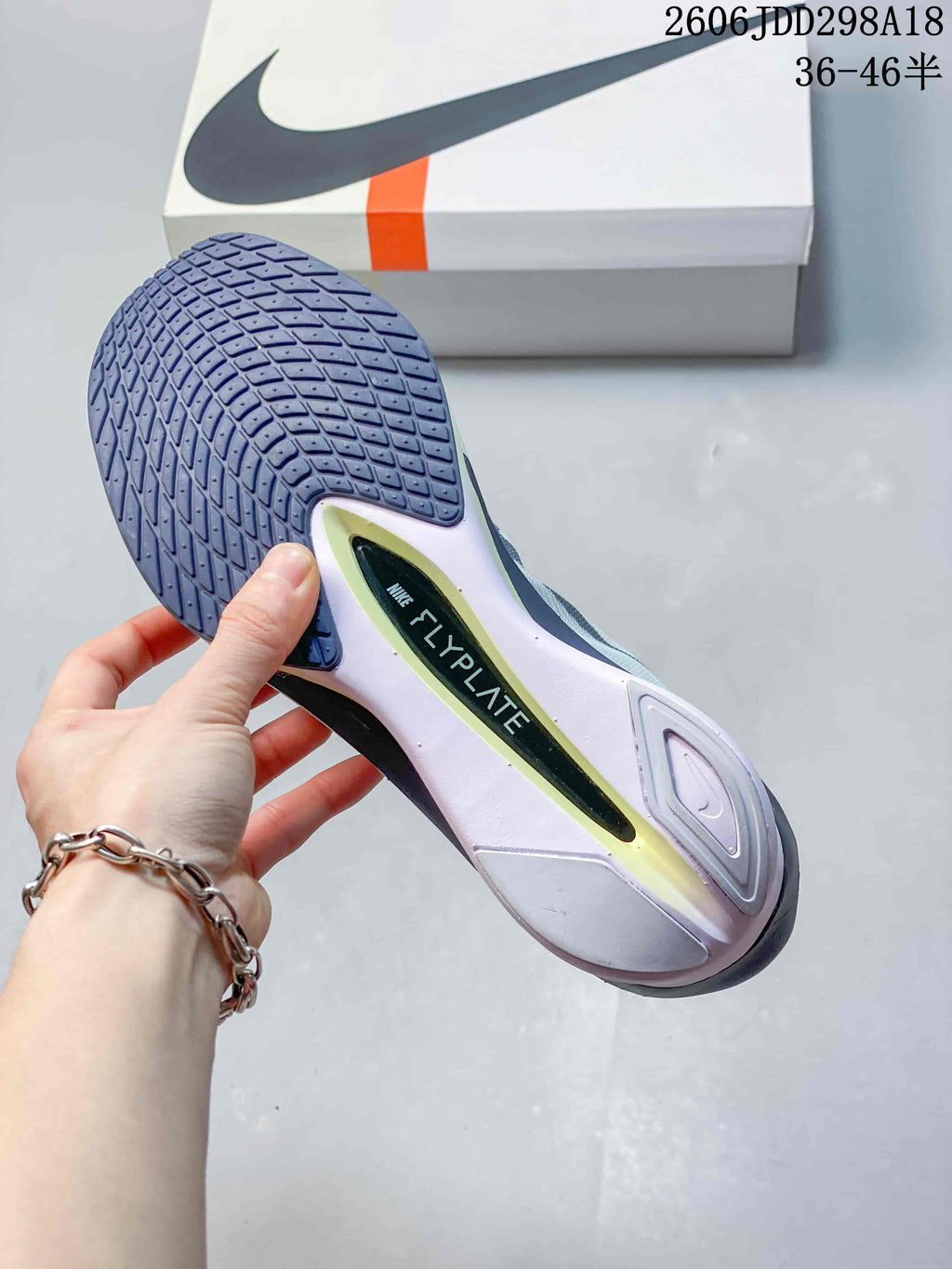 Underside of a Nike ZoomX Vaporfly NEXT% 4 shoe showing the outsole tread