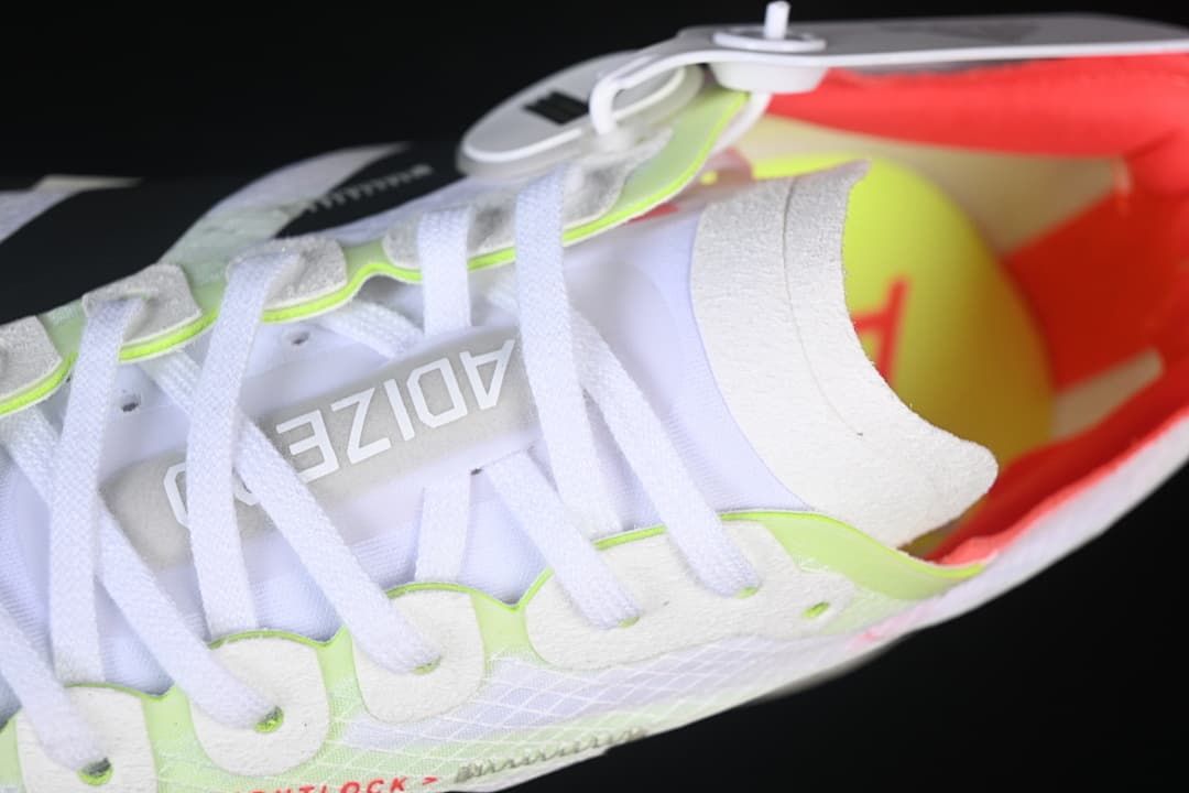 Close-up of the laces, tongue, and neon-accented eyelet area.