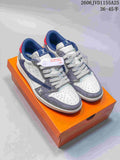 Gray, white, and navy low-top sneakers with patterned side panels on an orange box
