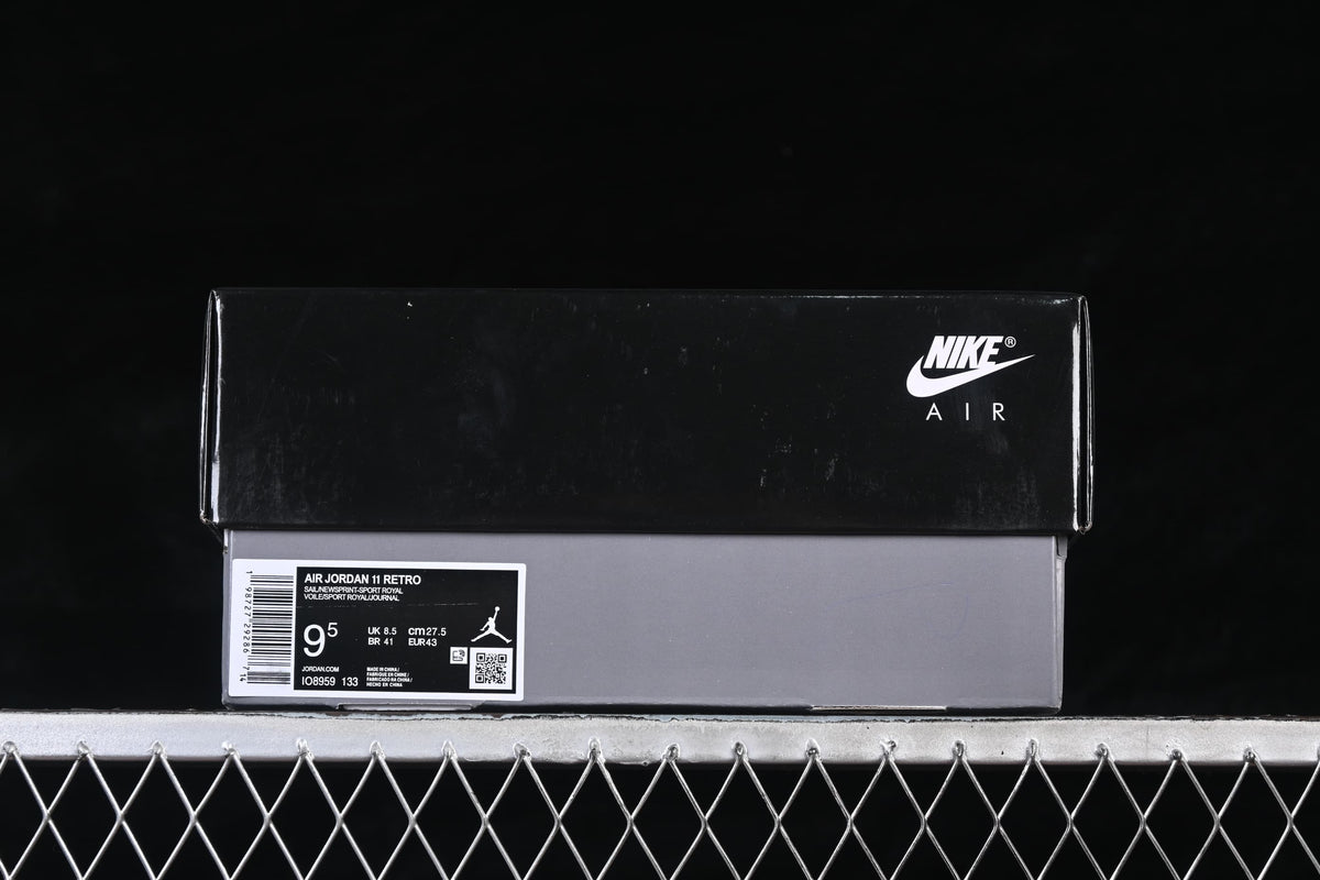 Nike Air shoebox with a product label showing Air Jordan 11 Retro, code IO8959-133, and EU size 43.