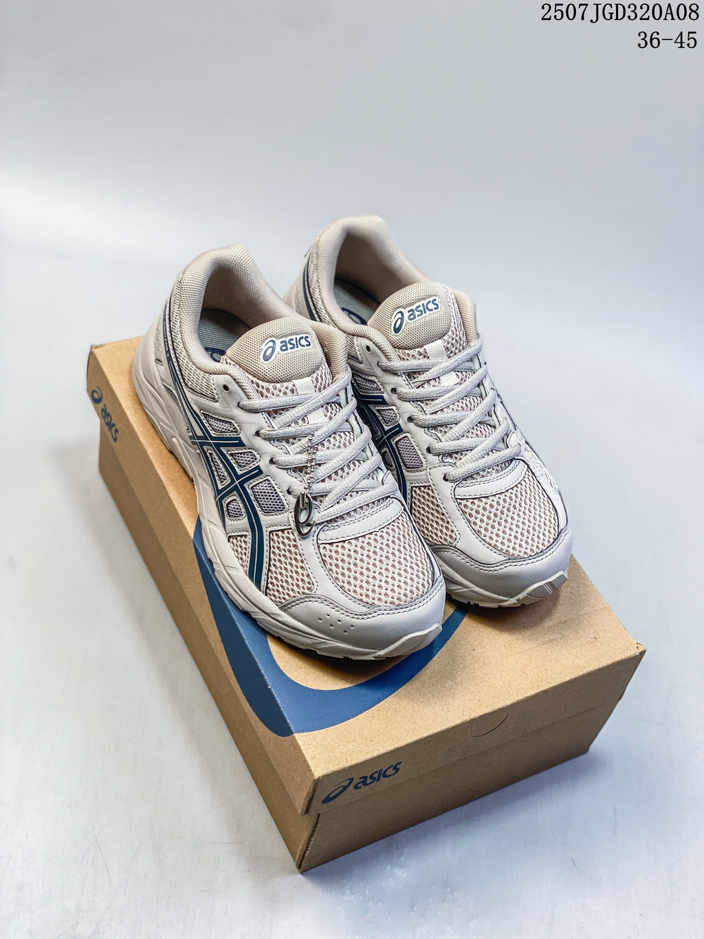 Pair of gray ASICS Gel-Contend 4 running shoes with navy detailing on a shoe box