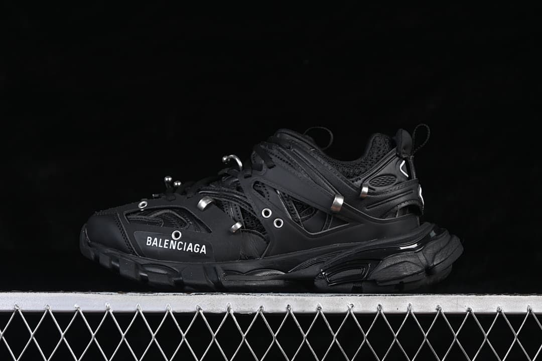 Black Track Piercing sneaker shown in side profile