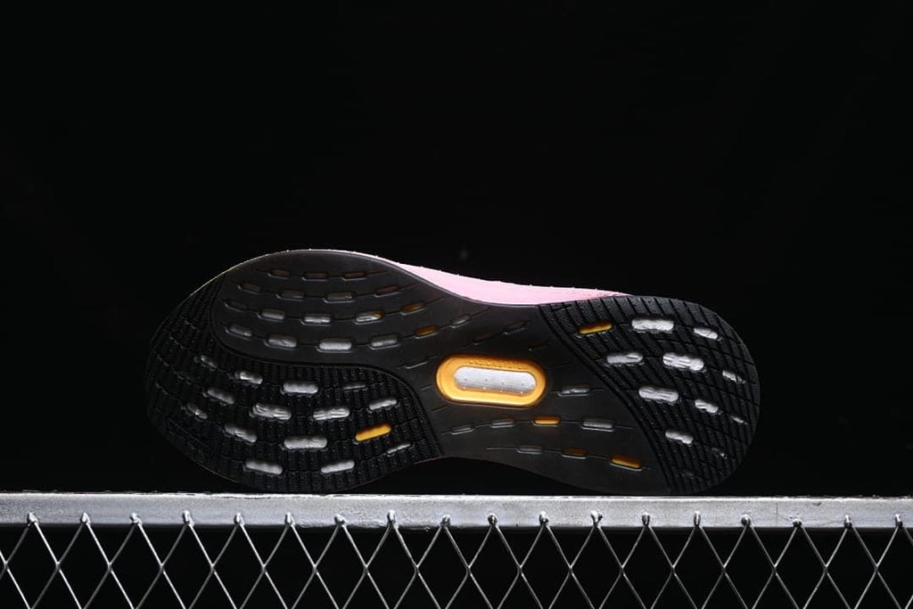 Underside view showing the black outsole with white and yellow details.