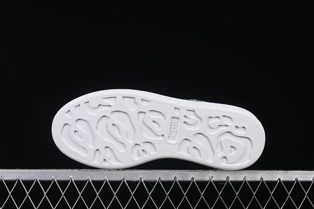 Underside view showing the patterned white outsole.