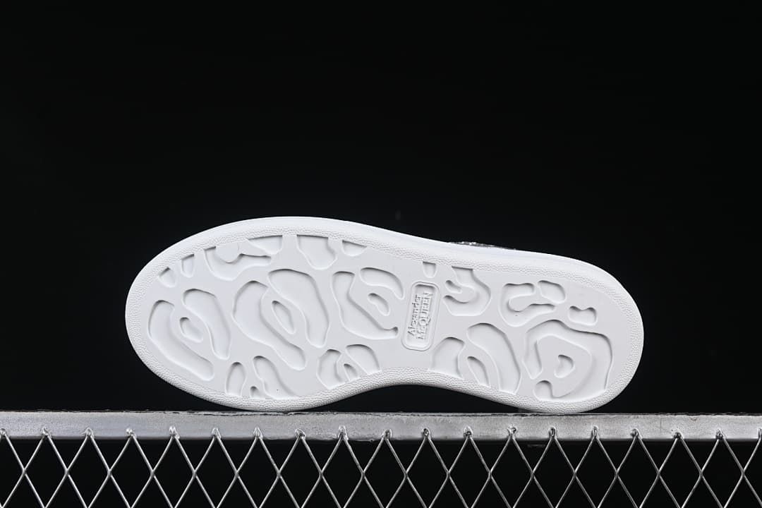 Underside view showing the patterned white outsole.