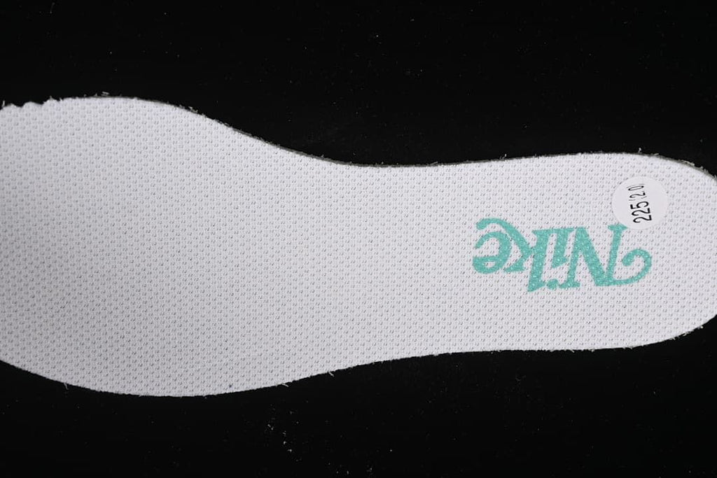 Top view of shoe insole with Nike branding and a sample label