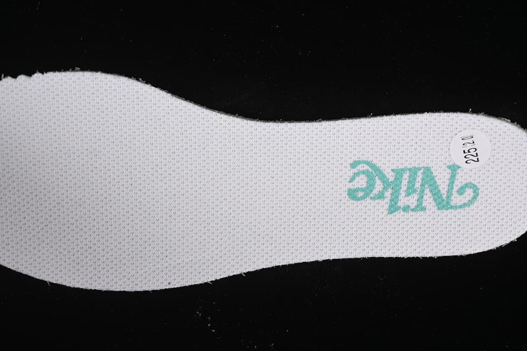 Top view of shoe insole with Nike branding and a sample label